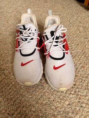 Nike White Sneakers with Red Swooshes and Black Trim